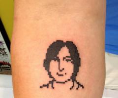 Young Steve Jobs pixel tattoo