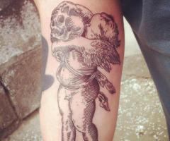 Angel with skull tattoo