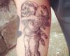 Angel with skull tattoo