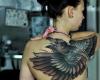 Bird on back tattoo