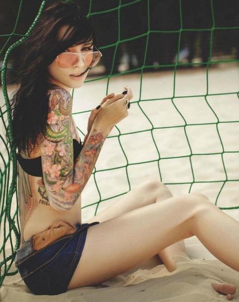 Girl tattoo on beach