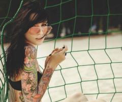 Girl tattoo on beach