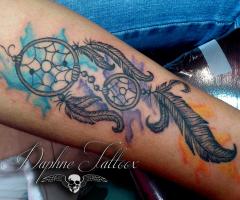 Dreamcatcher arm tattoo