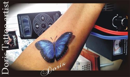 3d color butterfly arm tattoo