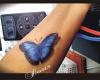 3d color butterfly arm tattoo