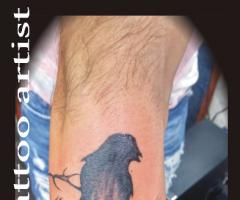 Crow arm tattoo