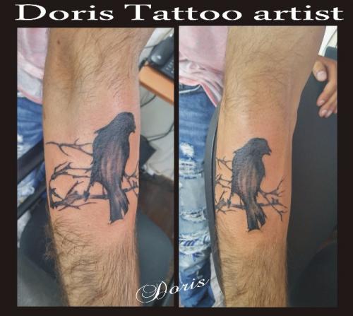 Crow arm tattoo