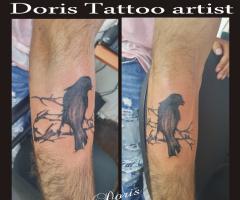 Crow arm tattoo