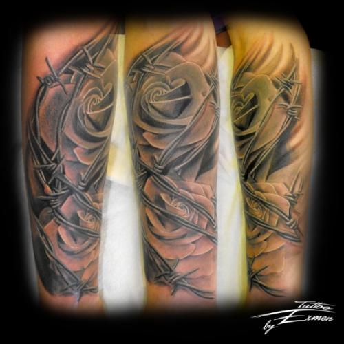 Rose and barbed wire tattoo