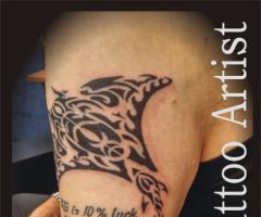 Trigon arm tattoo
