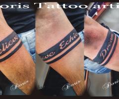 Black bracelet tattoo