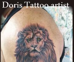 Lion heart arm tattoo