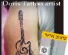 http://www.tattooset.com/images/tattoo/2016/02/04/25457-guitar-with-notes_tiny.jpg